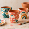 plant pots painted with flowers and colourful patterns